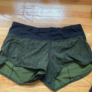 Workout shorts with dark green lace pattern